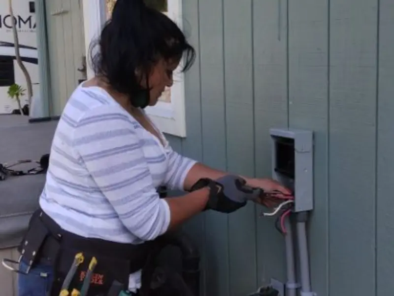 Licensed electrician wiring an exterior subpanel in Wallace