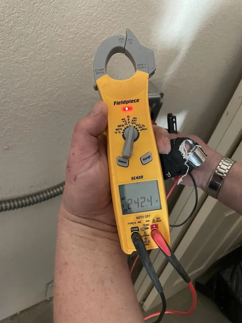 Voltage testing with clamp meter during Whole House Surge Protector in Wallace